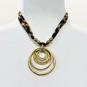 Y2K 2000s style Gold tone circle pendant necklace with leopard print fabric
